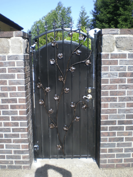 iron gate built with brick wall