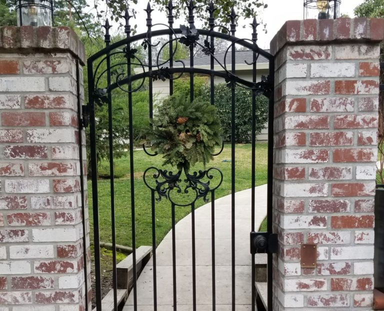 A metal gate with a wreath