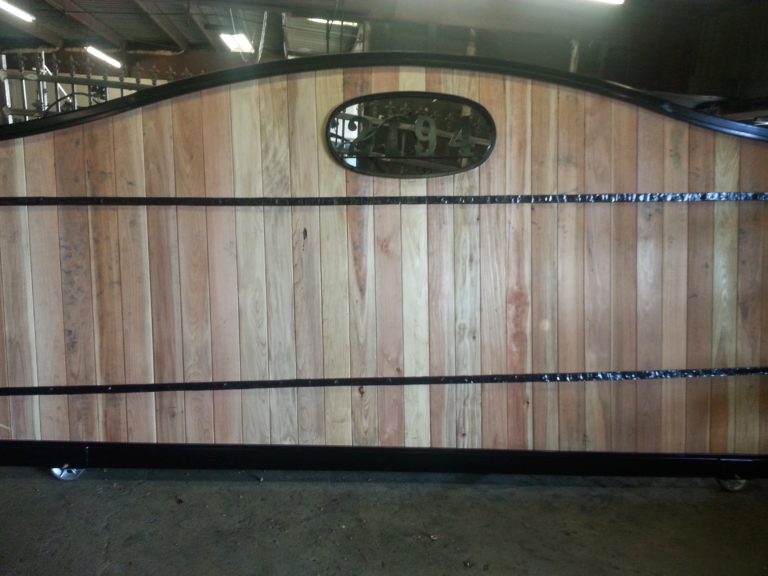 Metal and wood driveway gate