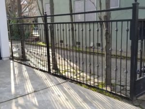 wrought iron fence on a driveway
