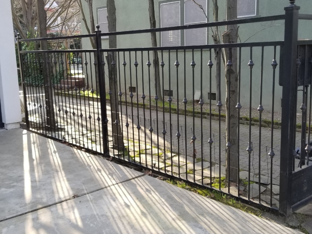 wrought iron fence on a driveway
