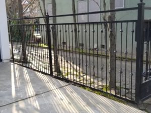 Metal fence built along a driveway
